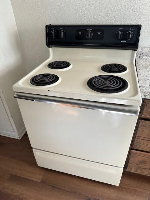 kitchen with white range with electric cooktop and dark hardwood / wood-style flooring