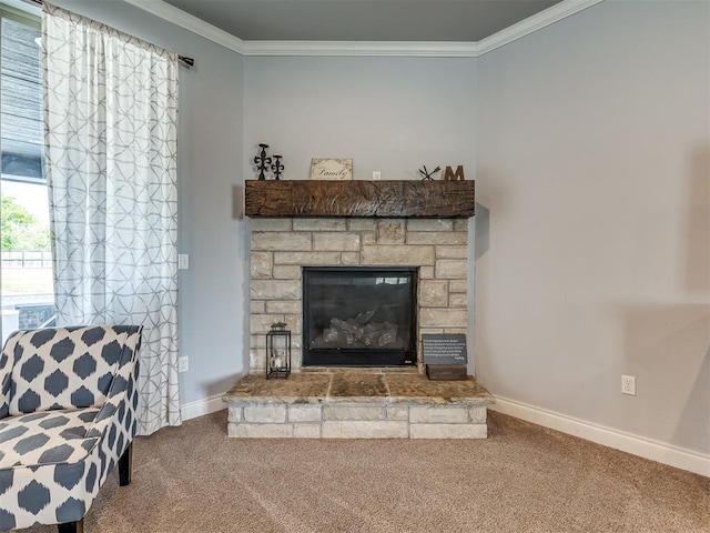 sitting room with a stone fireplace, crown molding, and carpet floors