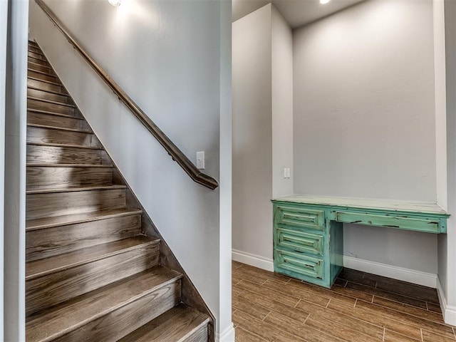 stairway featuring hardwood / wood-style floors