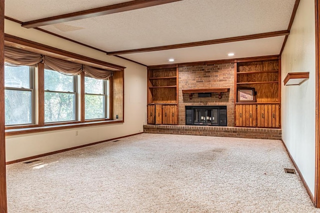 unfurnished living room with carpet flooring and a textured ceiling