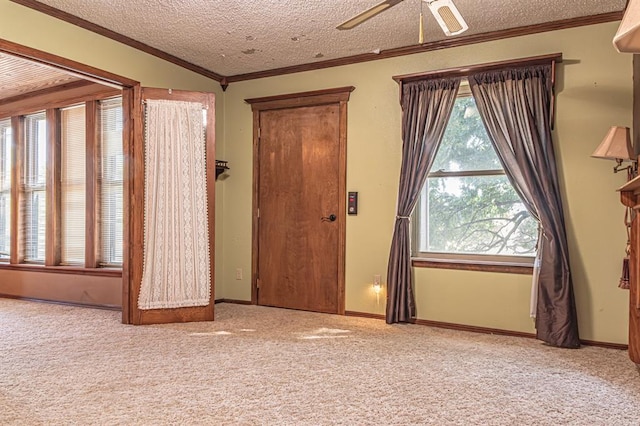 interior space featuring lofted ceiling, a textured ceiling, ceiling fan, and ornamental molding