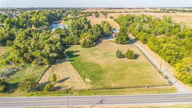 birds eye view of property with a water view and a rural view