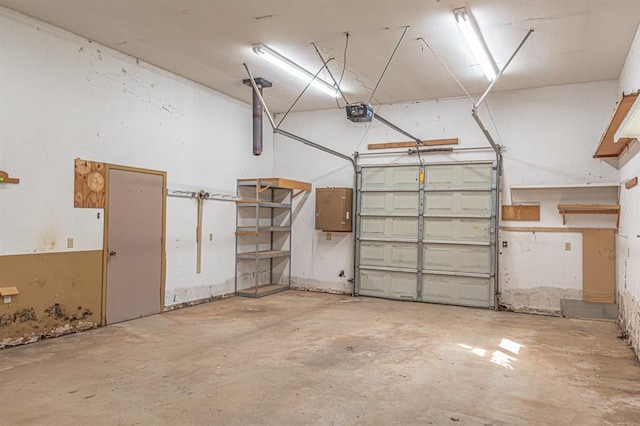 garage featuring a garage door opener and electric panel