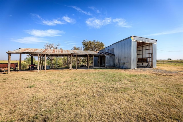 view of outbuilding with a lawn