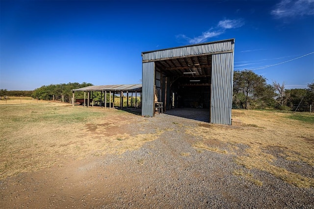 view of outbuilding with a rural view