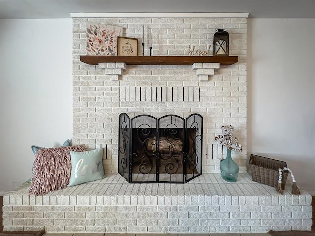 details with a brick fireplace