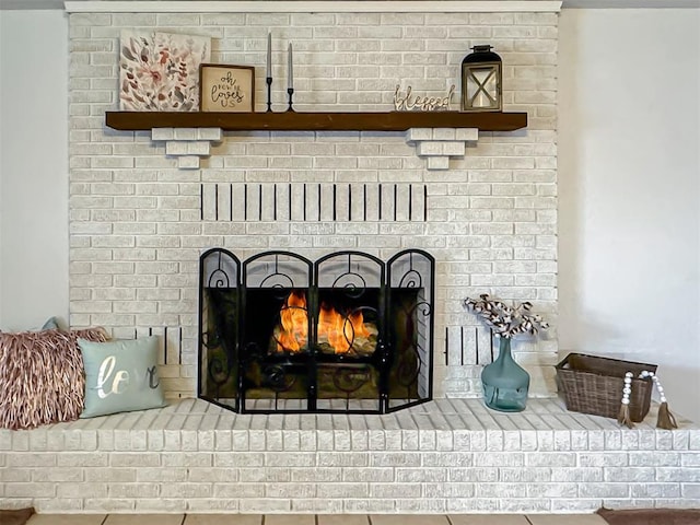 room details featuring a brick fireplace