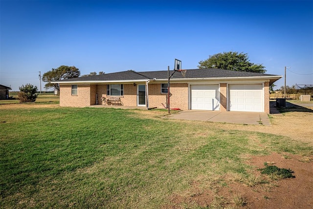 ranch-style house featuring an attached garage, concrete driveway, a front lawn, and brick siding