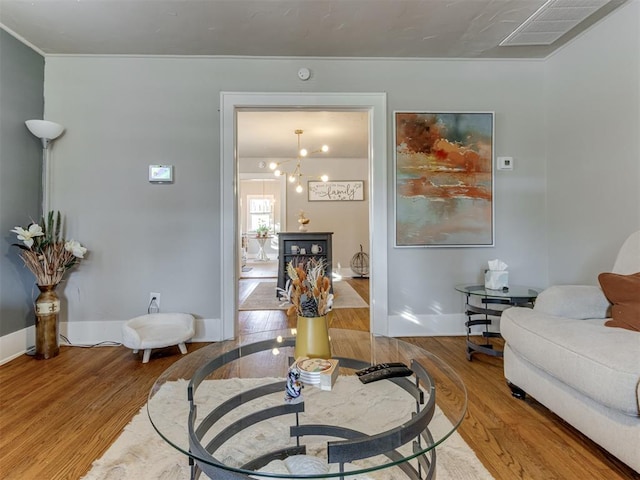 living room with hardwood / wood-style flooring and a chandelier