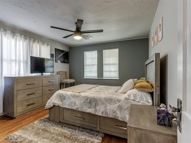 bedroom featuring ceiling fan and wood-type flooring