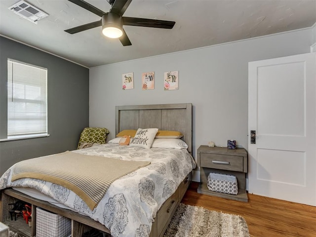 bedroom featuring hardwood / wood-style flooring and ceiling fan