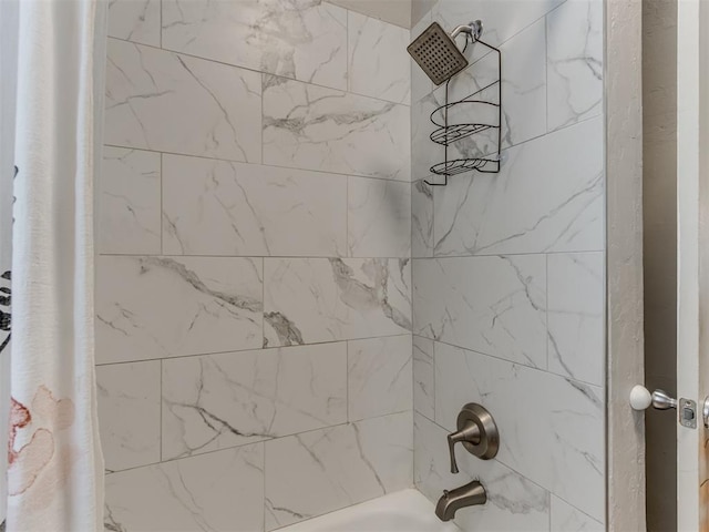 bathroom featuring shower / bathtub combination with curtain