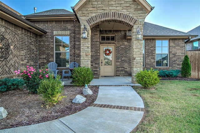 doorway to property with a yard