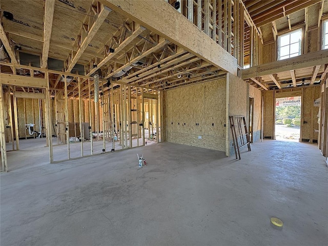 misc room with concrete flooring and a healthy amount of sunlight