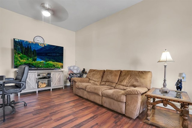 living room with ceiling fan and dark wood-type flooring