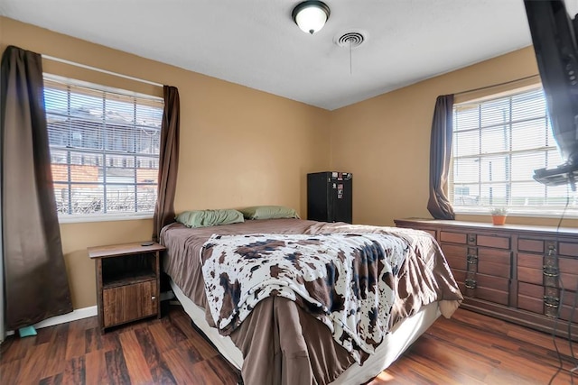 bedroom featuring dark wood-type flooring