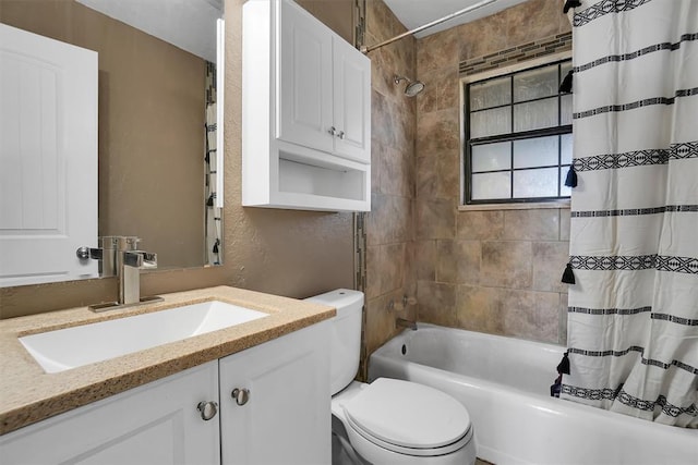 full bathroom featuring vanity, toilet, and shower / tub combo with curtain