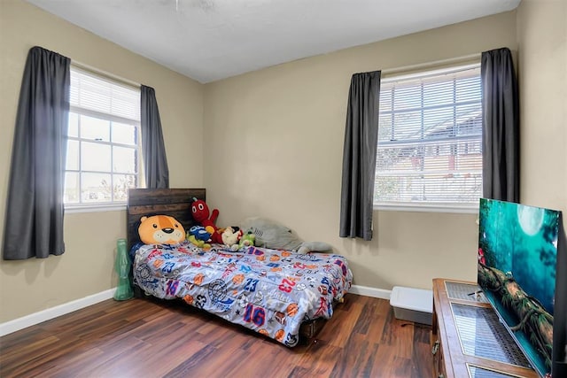 bedroom featuring dark wood-type flooring