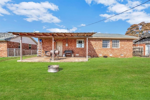 rear view of property with a patio area and a lawn