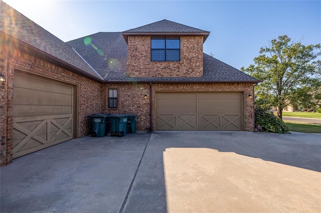 front facade with a garage