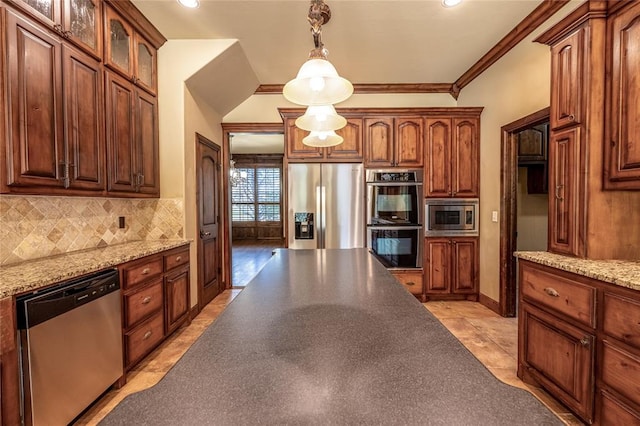 kitchen featuring light stone countertops, appliances with stainless steel finishes, decorative backsplash, crown molding, and pendant lighting