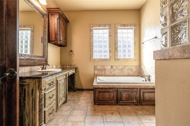 bathroom featuring a tub and vanity