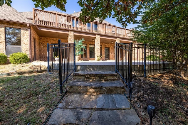 back of house with a balcony