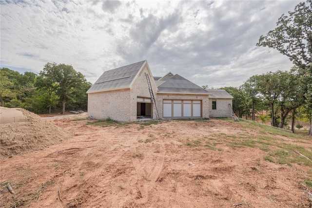 view of property exterior featuring a garage