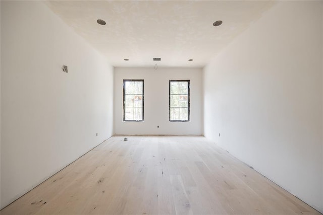 spare room with light wood-type flooring