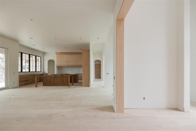 unfurnished living room with light hardwood / wood-style flooring