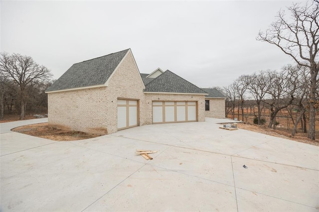 view of side of home with a garage