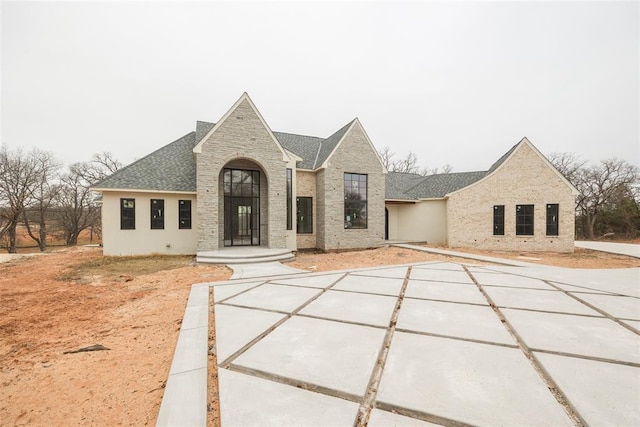 view of french country inspired facade