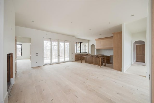 unfurnished living room featuring light hardwood / wood-style floors