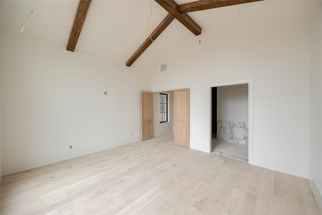 unfurnished bedroom featuring beamed ceiling, high vaulted ceiling, and light wood-type flooring