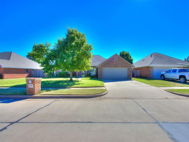 view of front of property featuring a front lawn and a garage