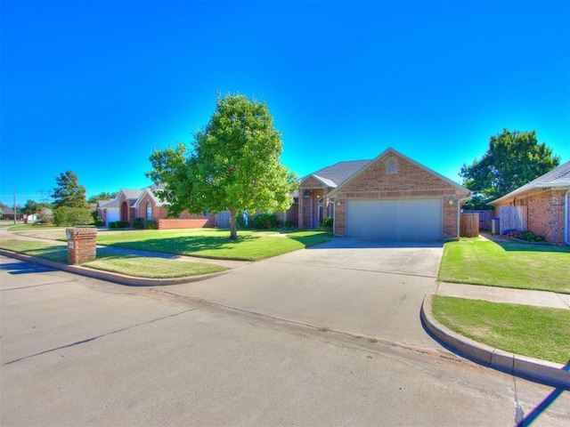 single story home with a garage and a front lawn