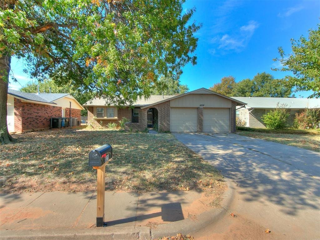 ranch-style home with a garage