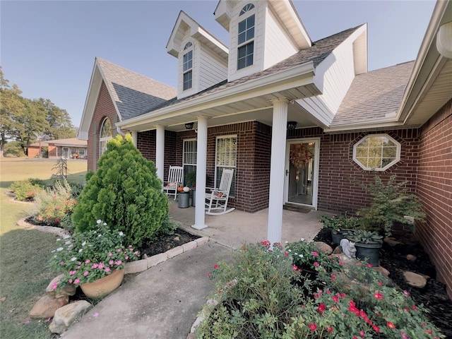 entrance to property with covered porch