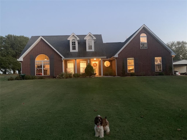 new england style home with a lawn