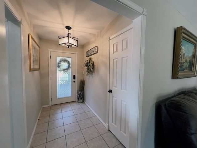 entryway with light tile patterned floors