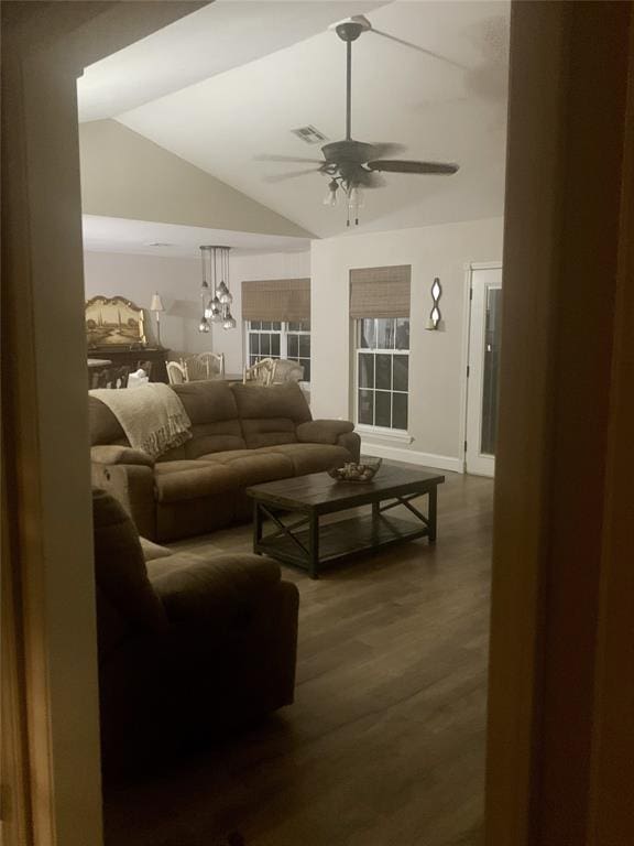 living room featuring lofted ceiling, ceiling fan, and dark hardwood / wood-style floors