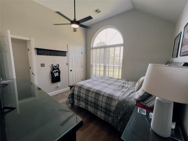 bedroom featuring ceiling fan, dark hardwood / wood-style flooring, and vaulted ceiling