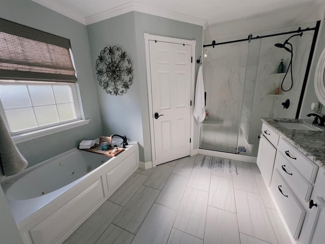 bathroom with vanity, crown molding, and shower with separate bathtub