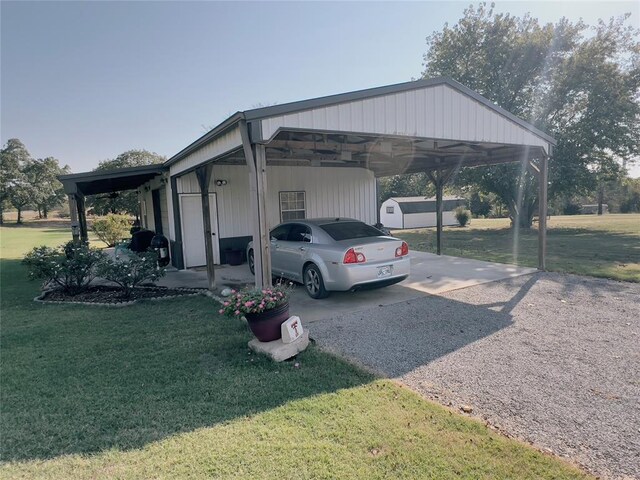 view of parking with a yard and a carport