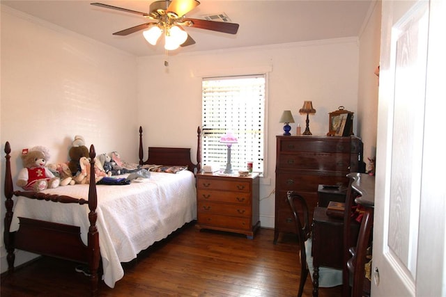 bedroom featuring ceiling fan, crown molding, and dark wood-type flooring