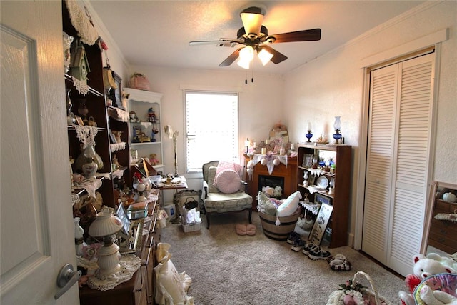 misc room featuring carpet, ceiling fan, and ornamental molding