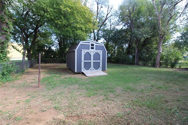 view of outdoor structure featuring a lawn