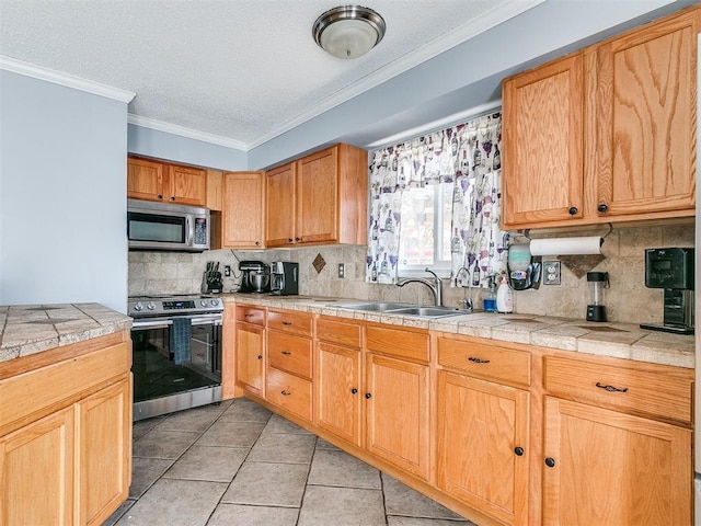 kitchen with sink, tasteful backsplash, appliances with stainless steel finishes, light tile patterned floors, and ornamental molding