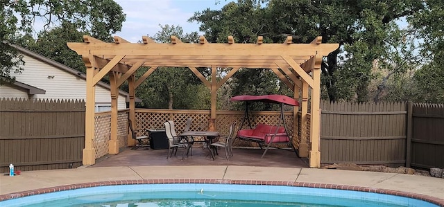 view of swimming pool with a pergola