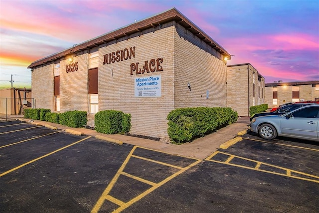 view of outdoor building at dusk